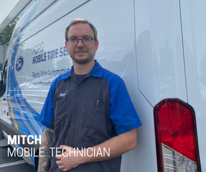 multiple car tires on a storage rack